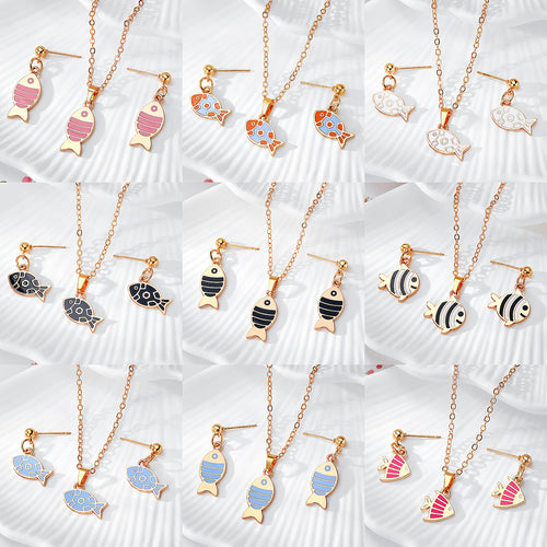 Nine gold enamel fish earring necklace set colorways in a grid layout