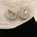 Sculptural Open Oval Stud Earrings in Gold and Silver Tones view 7