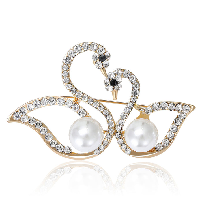 Facing Double Swan Brooch With Two Pearls in Gold or Silver Tone