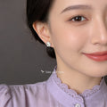 Silver Camellia Flower Stud Earrings Green Center Stone view 2