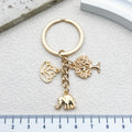 Gold-Tone Elephant Keychain With Lotus And Tree Charms view 6
