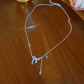 Silver Tone Bow and Cross Charm Draped Necklace Fashion Jewelry view 6