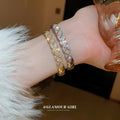 Crosshatched Crystal Hinged Bangle In Gold Tone Or Silver Tone view 2