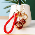 Jeweled Peanut and Auspicious Charm Keychains with Braided Wrist Loops view 9