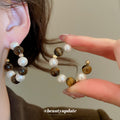 Brown And White Beaded Hoop Earrings In Two Patterns view 4