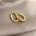 Gold-Tone Thick Polished Oval Huggie Hoop Earrings view 3