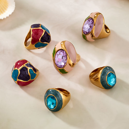 Grouped style view of oversized enamel and glass statement rings in main image 2.
