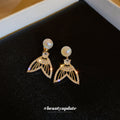 Gold-Tone Faux Pearl and Cubic Zirconia Mermaid Tail Earrings view 4
