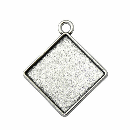 Close view of diamond-oriented square bezel trays in two antique finishes