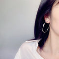 Silver Tone Large Wavy Hoop Earrings With Polished Finish view 3