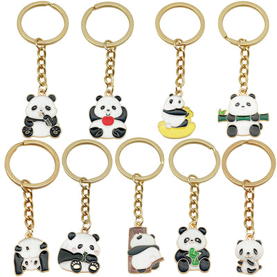Front display of eight apple bamboo and rocking panda keychains with visible colors and attached hardware