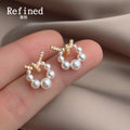 Gold Tone Clear Stone Bow And White Pearl Circle Stud Earrings view 4