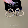 Silver Tone Twisted Open Heart Stud Earrings with Textured Edges view 4