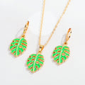 Gold Tone Green Monstera Leaf Necklace and Huggie Earring Options view 1