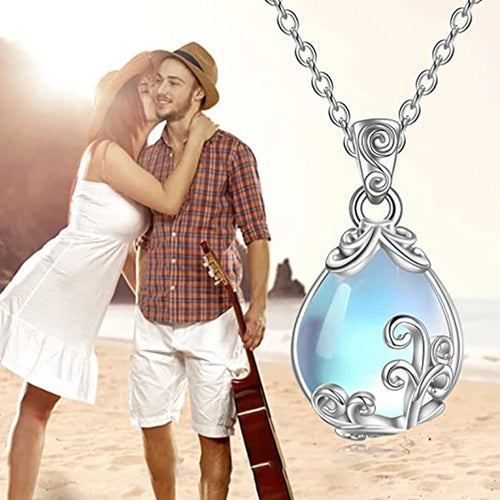 Second product view showing silver-tone aqua pear-shaped filigree scroll pendant necklace