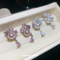 Pearl Cluster Teardrop Dangle Stud Earrings With Polished Metal Details view 1