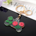 Transparent Resin Pressed Flower Dog Bone Clip Keychains in Three Colors view 2