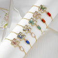 Gold Tone Pressed Flower Butterfly Slider Bracelets in Six Designs view 1