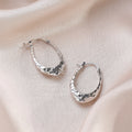 Hammered Silver Tone Sculpted Oval Medium Hoop Earrings view 3