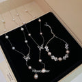 Silver Pearl Butterfly Y Necklaces And Bow Slider Bracelet view 1