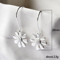 White Gold Daisy Flower Hook Earrings Textured Center Detail view 5