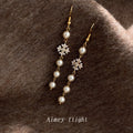 Gold Tone White Pearl Snowflake Long Tassel Hook Earrings view 1