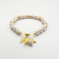 White Cross Bead Bracelet with Gold-Tone Cross and Angel Wing Charms view 3