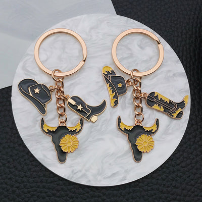 Overview showing the available color and design variations of the black gold western hat boot and floral longhorn keycha