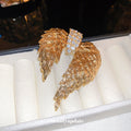 Gold Tone Asymmetrical Angel Wing Brooch With Clear Crystals view 2
