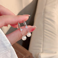 Silver Tone Crystal Huggie Earrings with Pearl Look Drops view 1