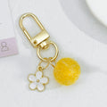 Wool Felt Ball Keychain With White Enamel Flower Charm And Gold-Tone Clasp view 11