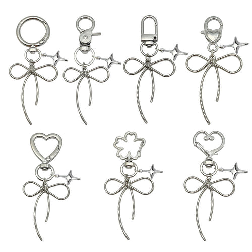 Image 1 showing a set of four metal key chains.