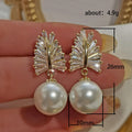 Gold Tone Leaf Earrings With White Faux Pearl Drops view 5