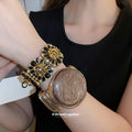 Gold Black Rose Stretch Bracelet and Round Disc Wire Cuff view 1