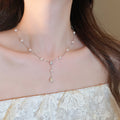 Delicate Floral Y Necklace with Pearl-Like Beads with Polished Metal Details view 3