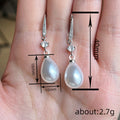 Pearl-Like Teardrop Long Earrings In Gold And Silver Tones view 5