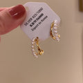 White Pearl Double Row Gold Tone Huggie Earrings With Metal Details view 2