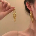 Gold Tone Layered Leaf Cluster Long Tassel Hoop Earrings view 3