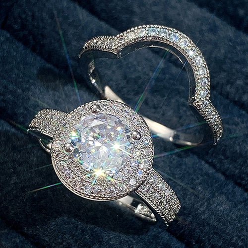 Halo center ring and curved crystal band separated on blue velvet