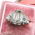 Emerald Cut White Stone Statement Ring with Cluster Halo view 1