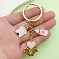 Baby Shower Charm Keychains Featuring Pink Bottle Clasp Across 14 Pictured Variations view 1