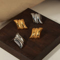 Gold Steel Twin Curve Stud Earrings Beaded Center Bar view 2