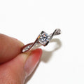 Round Clear Solitaire Twisted Ribbon Ring In Silver Tone view 5