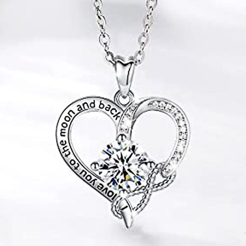 Side view of silver tone double heart pendant necklace