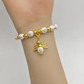White Cross Bead Stretch Bracelet Gold Angel Charm view 3