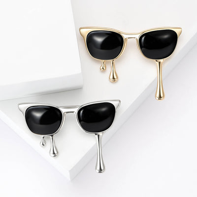 Front view of black sunglasses with two slim dripping accents