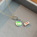 Red Tram and Globe Travel Charm Necklace in Two Metal Tones view 2
