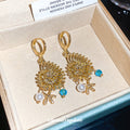 Gold-Tone Seashell And Starfish Pearl Huggie Earrings view 3