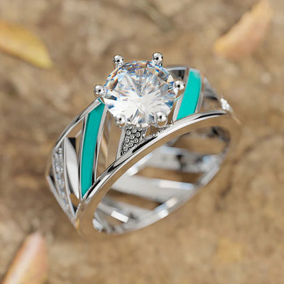 Front product view of the wide openwork ring with a clear center stone and turquoise color stripes