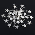 Small Star Charms in Four Distinct Open and Solid Shapes view 3